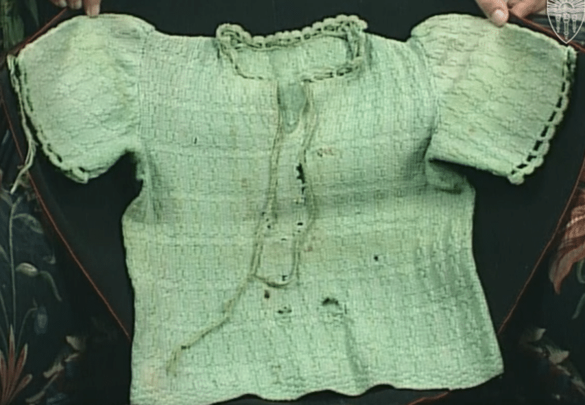 Photograph of the sweater knitted for Krystyna by her grandmother, which she wore when she was in the sewers of Lwow, courtesy of USC Shoah Foundation and Kristine Keren.